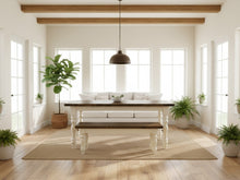 Load image into Gallery viewer, Five-foot farmhouse table and matching bench in a sunlit room with wide windows, greenery and neutral woven rug