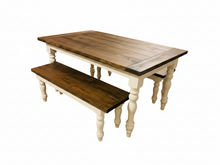 Load image into Gallery viewer, Close angled view of stained wooden farmhouse tabletop and matching bench with visible wood grain and white turned legs
