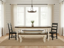 Load image into Gallery viewer, Dark walnut farmhouse table and two matching benches staged with black ladder-back chairs in a bright dining room
